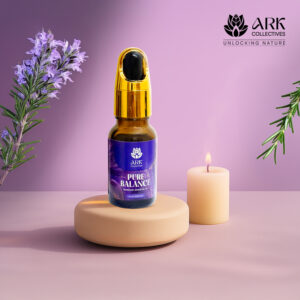 Pure Balance Rosemary Essential oil in a bottle placed on a luxury setting with candles