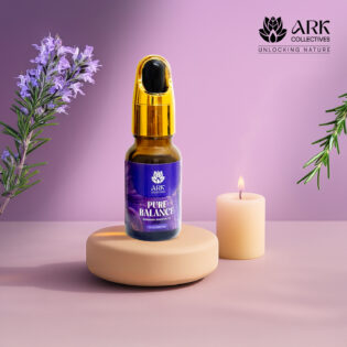 Pure Balance Rosemary Essential oil in a bottle placed on a luxury setting with candles